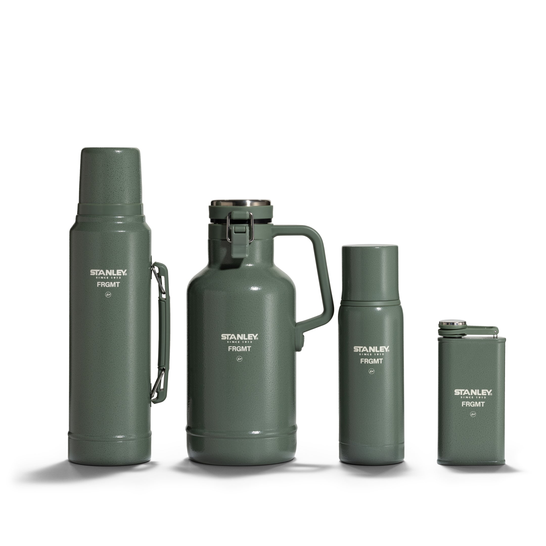 Four Stanley 1913 x FRGMT green vacuum insulated drinkware pieces: classic bottle, growler, small bottle, and flask.